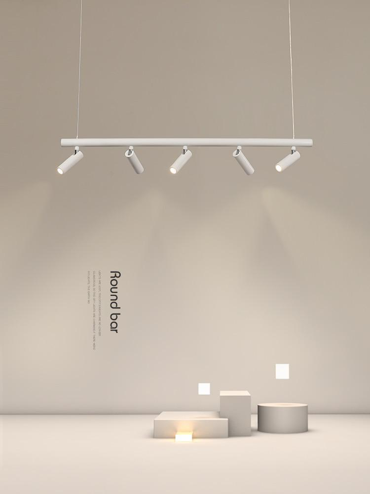 Lustra suspendata cu 5 spoturi orientabile albe, montaj pe bara rotunda, efect luminos directional pe platouri decorative
