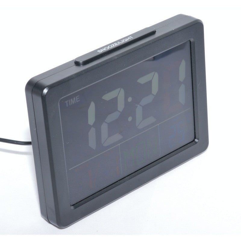 Ceas digital LCD cu display inchis, buton snooze vizibil pe partea superioara, profil frontal