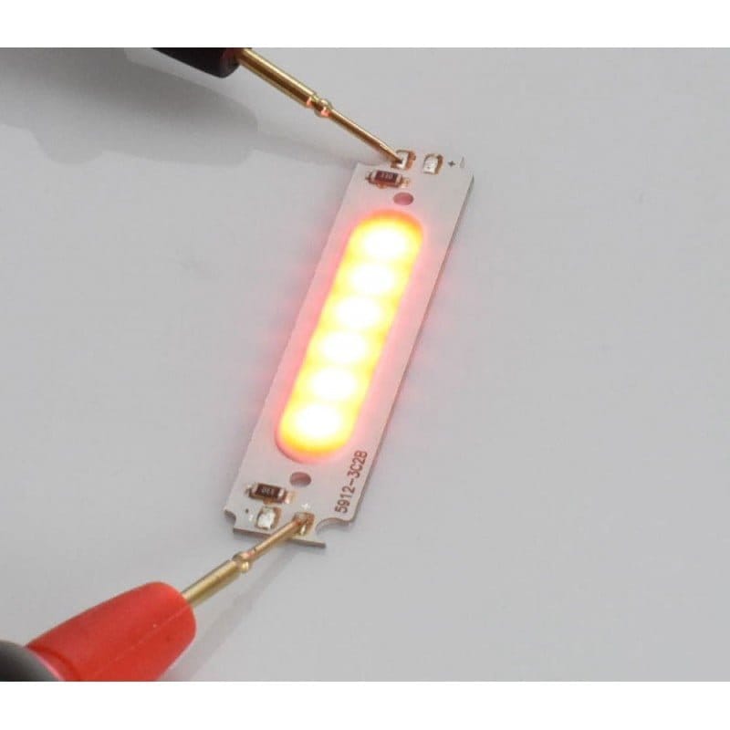 Chip LED COB rosu 2W 12V 58x13mm cu 6 segmente, testat cu sonde, emitand lumina rosie intensa