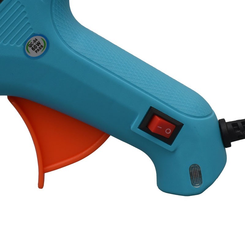 Pistol de lipit cu silicon, vedere apropiata pe intrerupator ON/OFF, maner texturat si indicator LED